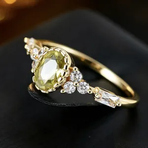 Elegant olive green zircon ring with sparkling side stones, vintage gold-plated geometric band.