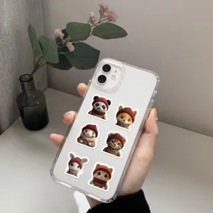 Detailed close-up view of the transparent phone case featuring cute animal stickers.