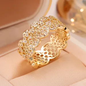 Gold honeycomb openwork ring with micro-set zirconia, elegant wide band fashion jewelry for women.
