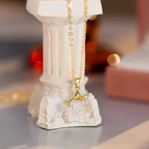 Gold-plated mini cocktail glass pendant necklace, delicate zircon inlay, elegant detail.