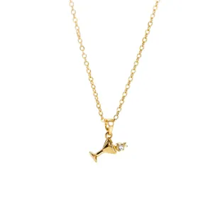 Gold-plated cocktail glass pendant necklace with sparkling cubic zirconia, delicate jewelry.