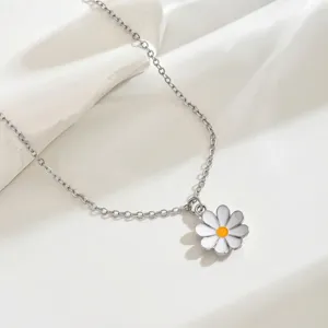 Silver chain necklace featuring a cute white enamel daisy flower pendant, fresh and stylish.