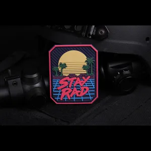 Tactical PVC morale patch with retro synthwave sunset and Stay Rad text for outdoor gear.