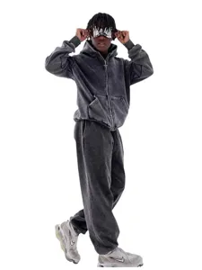 Detailed view of heavy washed grey zip hoodie and sweatpants set, vintage relaxed fit apparel.
