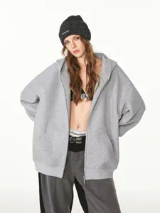 Detail view of heavyweight grey zip hoodie, oversized drop shoulder style with dual zippers.