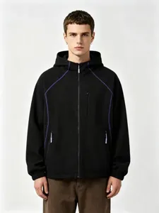 Detail view of black waffle knit zip hoodie jacket with purple contrast stitching for men and women