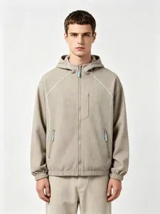 Close-up detail of the khaki waffle knit hooded zip-up jacket with textured fabric.