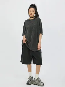 Vintage washed oversized t-shirt and shorts set for women, casual streetwear outfit.