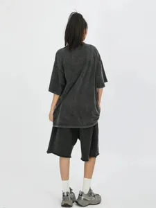 Washed oversized short sleeve t-shirt casual vintage summer streetwear apparel detail view.