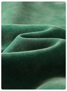 Close-up detail shot of the thick heavyweight fleece fabric, showing rich plush texture and soft folds.