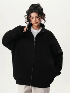 Detail view of a black full-zip hoodie for men and women, solid heavy fleece fabric.