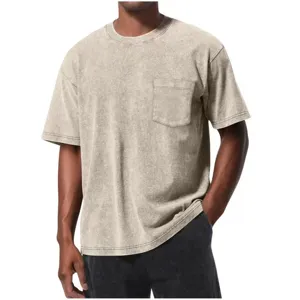 Detailed shot of the acid-washed men's t-shirt showing the chest pocket and round neckline.