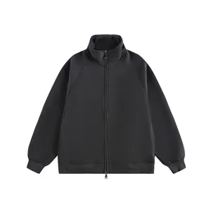 Detailed closeup view of black heavyweight stand collar full zip up jacket and ribbed hem style.