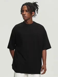 Detail view of the heavy solid color drop shoulder men t-shirt for casual summer wear.