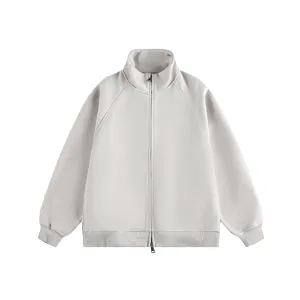 Detail view of a plain high-collar zip-up jacket with ribbed cuffs, minimalist style.