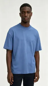 Men's solid blue oversized short sleeve t-shirt detail view, soft washed cotton fabric crewneck top.