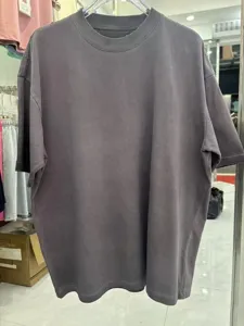 Detailed view of the vintage washed distressed oversized short sleeve t-shirt in dark grey.