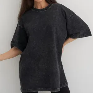 Detail view of vintage acid wash oversized short sleeve t-shirt, casual streetwear top.