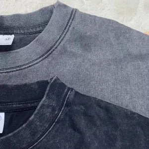Vintage washed short sleeve crewneck t-shirt fabric detail showing retro texture and style.