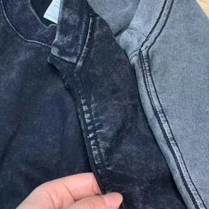 Close up view of vintage acid wash short sleeve t-shirt collar and fabric detail.