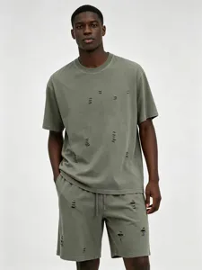 Distressed washed green t-shirt shorts detail, streetwear style, casual summer outfit view