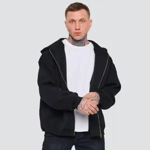 Close-up detail of the black heavy zip-up hoodie featuring metal zipper and loose casual fit.