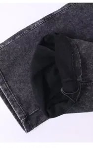 Close-up detail of vintage washed hoodie hem, heavy loopback fleece fabric with drawstring.