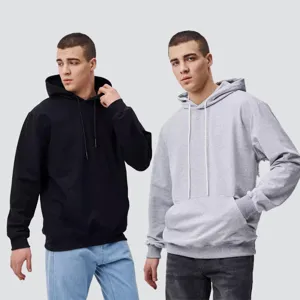 Detailed view showcasing the texture and loose fit of solid color hooded sweatshirts.