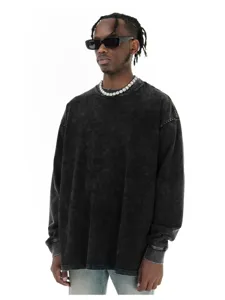 Close-up view of the vintage washed black long sleeve crewneck t-shirt fabric and collar.