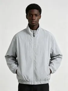 Detailed close-up of the stylish grey stand collar zip-up jacket highlighting smooth outerwear.
