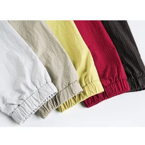 Detailed close-up view of grid pattern elastic fabric cuffs in multiple stylish colors.