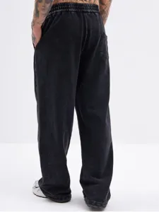 Detail view of vintage acid wash casual sweatpants featuring relaxed straight leg fit and elastic waist.