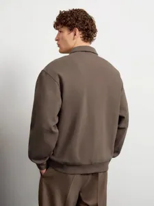 Detailed view of men's long sleeve lapel sweatshirt in solid brown, comfortable fit.