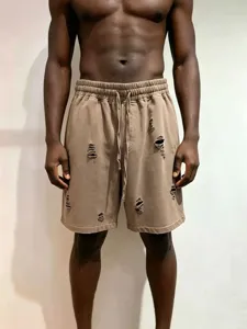Distressed sweat shorts with retro washed finish, elastic drawstring waist, and casual fit detail.