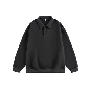 Close-up details of the black long sleeve polo sweatshirt collar and textured fabric.