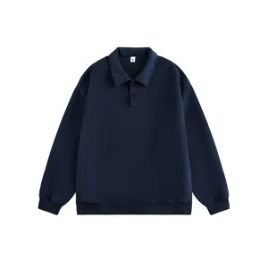 Detail view of the classic lapel collar and button placket on the dark blue men's sweatshirt.