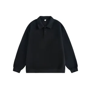 Close-up detail of the black lapel sweatshirt showing collar texture and rib-knit cuffs.