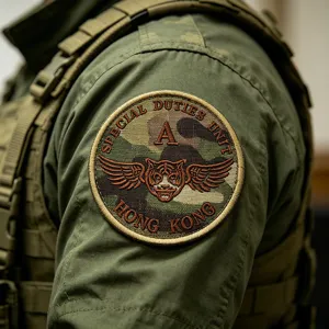 Close-up of SDU Hong Kong tactical morale patch, featuring detailed embroidery and camo fabric.