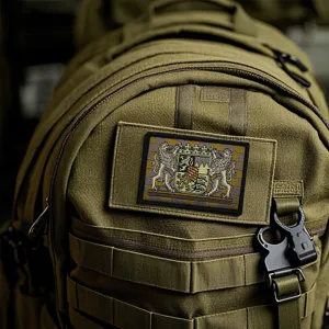 High quality tactical backpack with embroidered coat of arms morale patch in army green.
