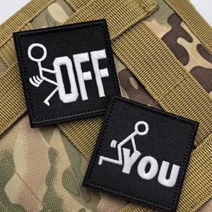 Black and white embroidered morale patch set with funny stick figure and letter design for tactical gear.