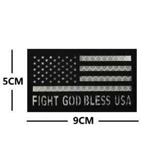 Close-up detail of the tactical morale patch showing reflective US flag and lettering.