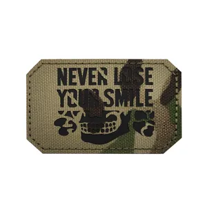 Detailed view of the tactical morale patch featuring camo pattern, skull graphic and slogan.