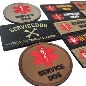 Detailed close-up of embroidered tactical service dog patches with hook and loop backing.