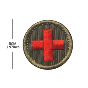 Round tactical red cross embroidered patch badge, detail view of 5cm emergency emblem.