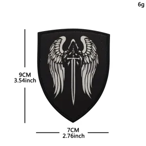 Detail view of the embroidered morale patch featuring a dark wing and sword design, 9x7cm.