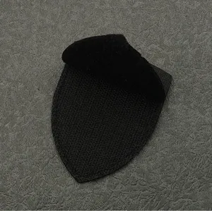Detailed view of the black tactical patch backing, durable hook and loop fastener shield.