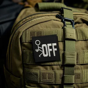 Tactical embroidered morale patch with funny stick figure design and bold OFF letter.