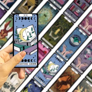 Detailed view of retro tarot reading bookmark with moon phase design held by hand, ideal gift.