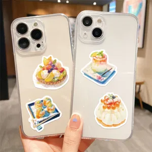 Closeup of cute dessert watercolor stickers detail showcasing colorful fruit tarts and pastries.