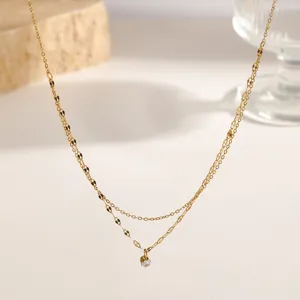 Minimalist double-layered gold titanium steel necklace featuring a single crystal pendant